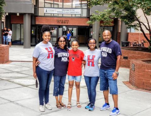 Family in Front of Howard Housing
