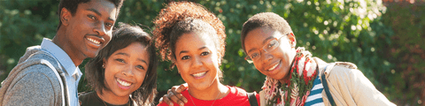 A group shot of Howard students smiling for the camera.