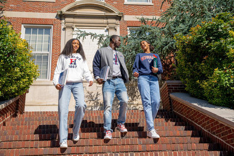 Students walking down the Founders Library stairs.