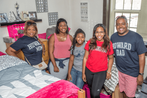 Parents with student in dorm room